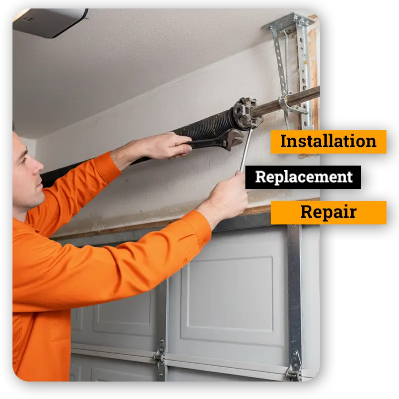 Technician adjusting garage door torsion spring